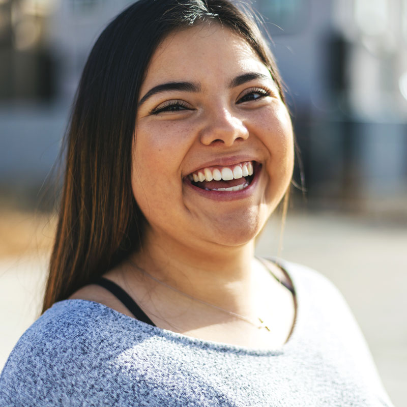 young adult woman laughing