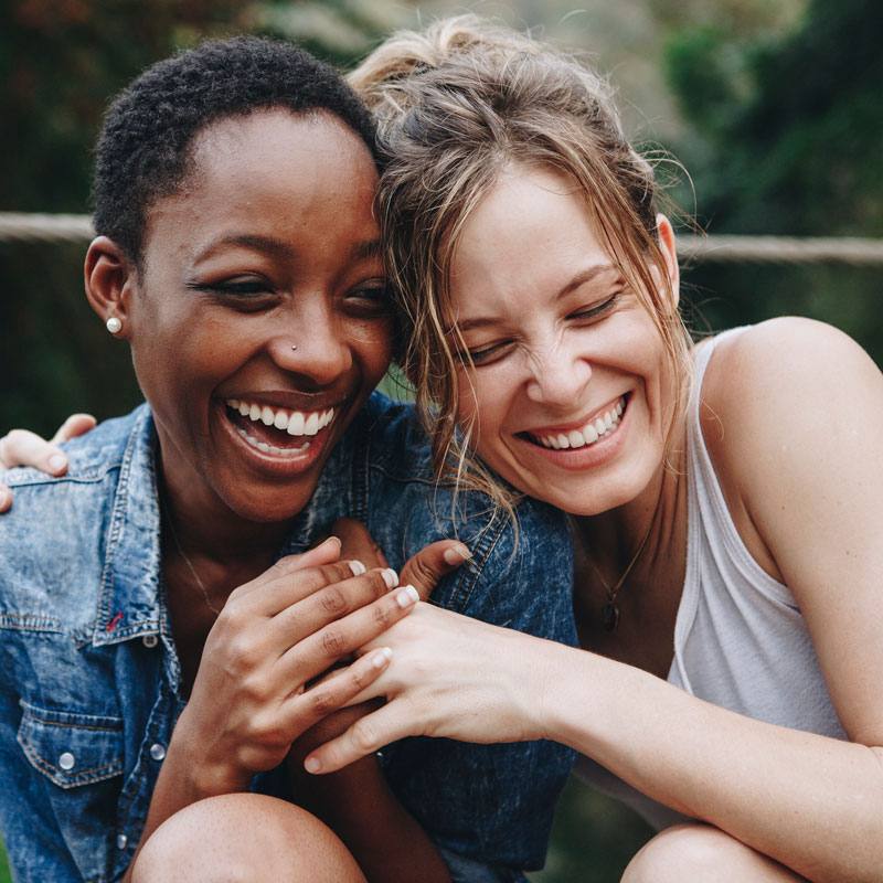 young adult female friends laughing